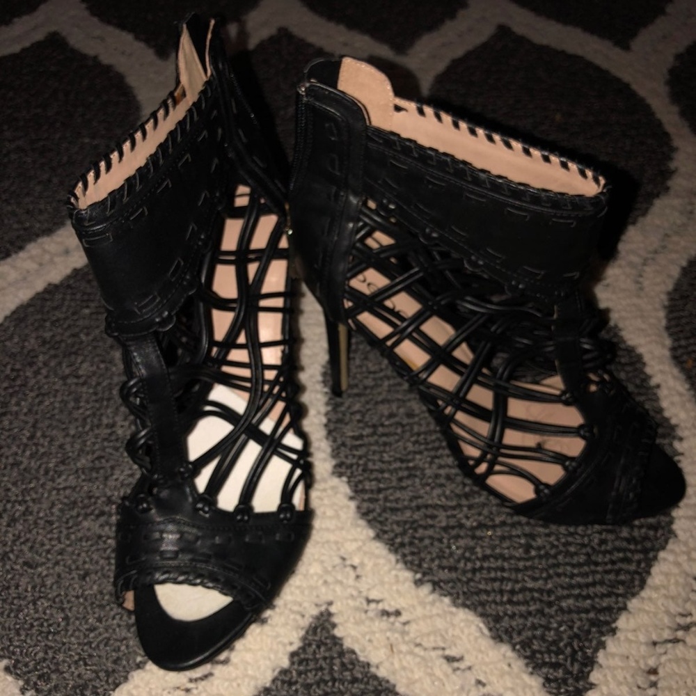 Black leather Bebe weaved booties
